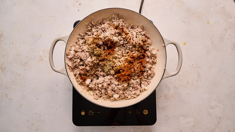 turkey and seasonings in a skillet