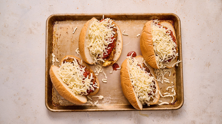 mozzarella and tomato piled onto hot dog