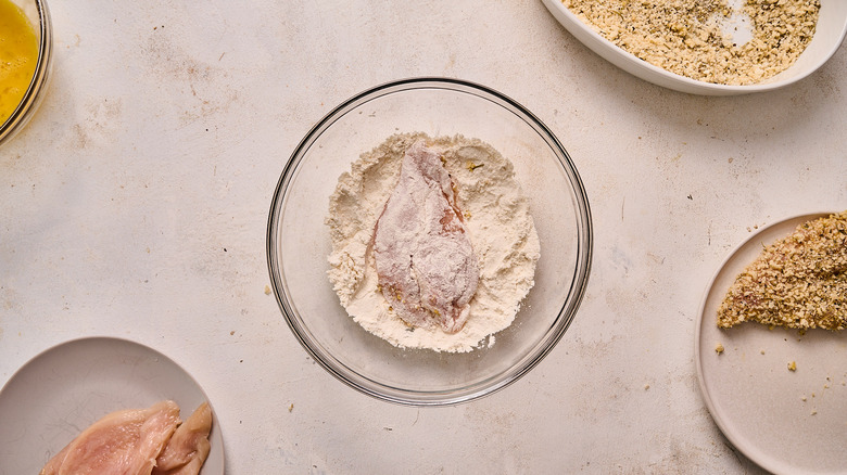 coating chicken in flour