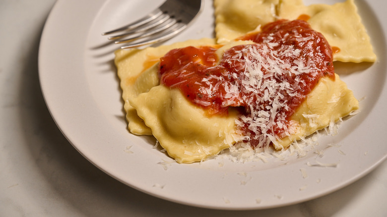 Cooked ravioli on a plate with sauce