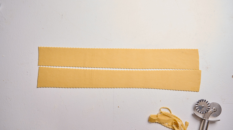 Pasta sheet trimmed into two sheets