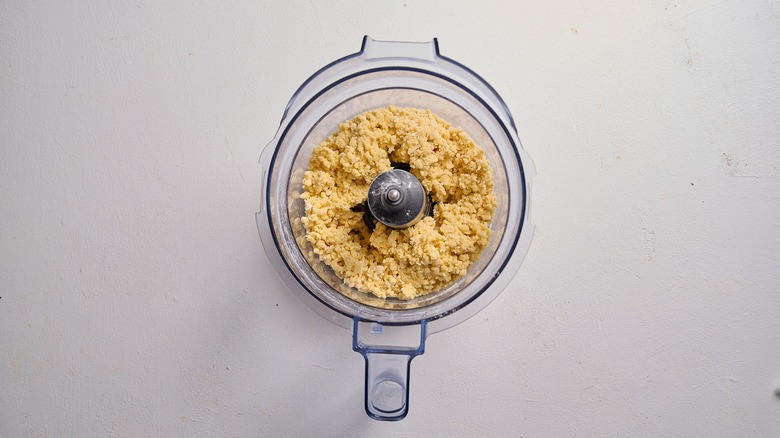 crumbles of dough in a food processor