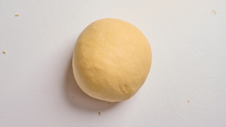 smooth ball of dough on a table