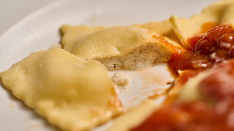 cheese ravioli cut in half on a plate