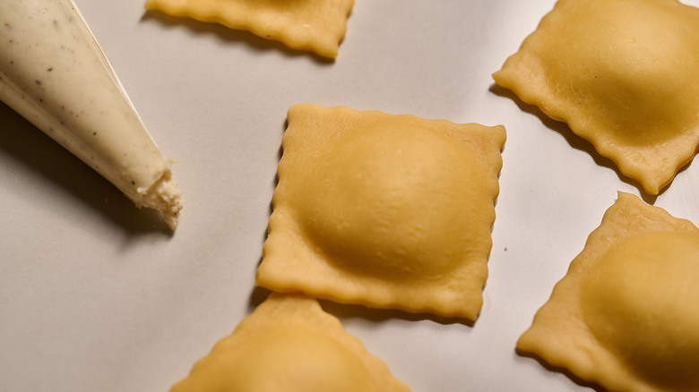uncooked ravioli on a table