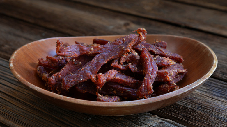 homemade beef jerky in wooden bowl