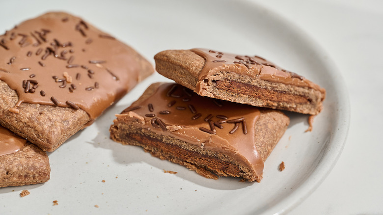 Pop tart sliced in half on a plate