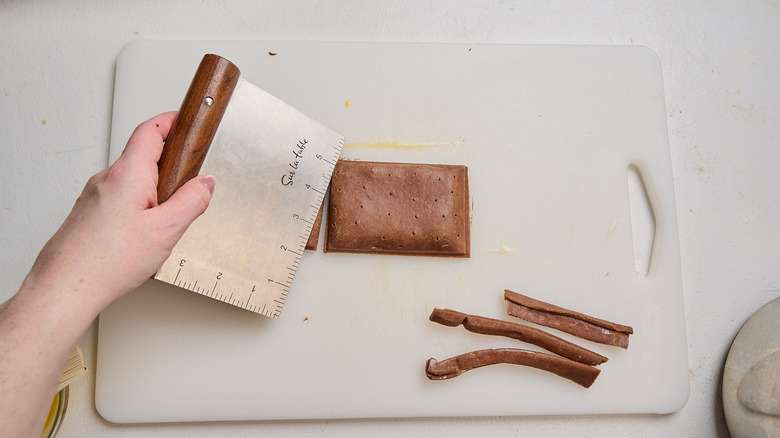 slicing away edges of pop tart