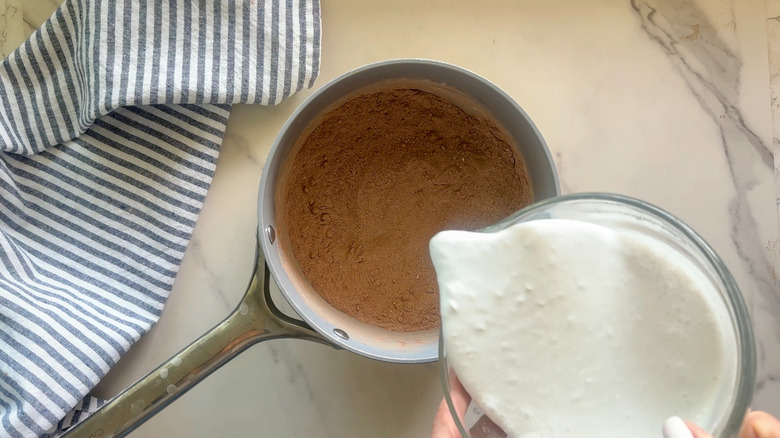 pouring milk into pot