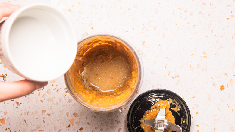 Diluting sauce with water.