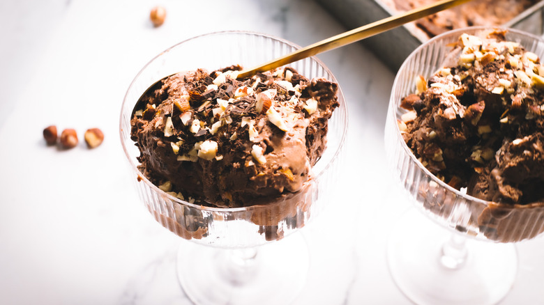 Two servings of Nutella ice cream in front of container