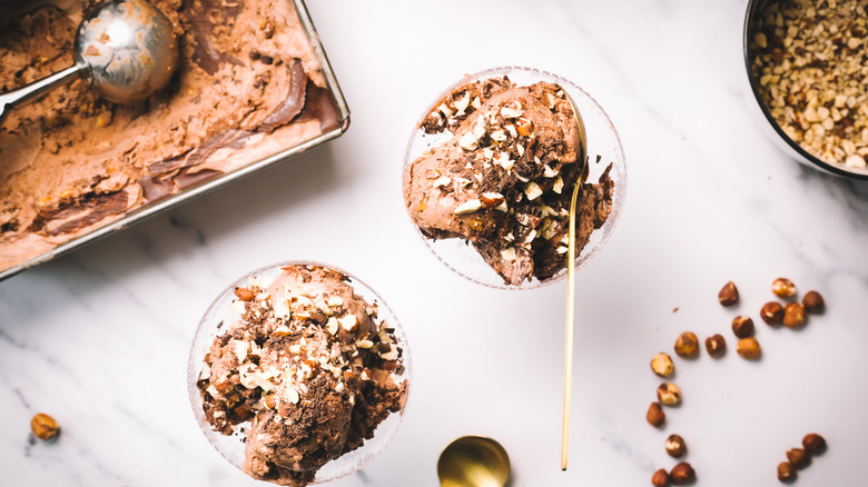Two servings of Nutella ice cream in front of container