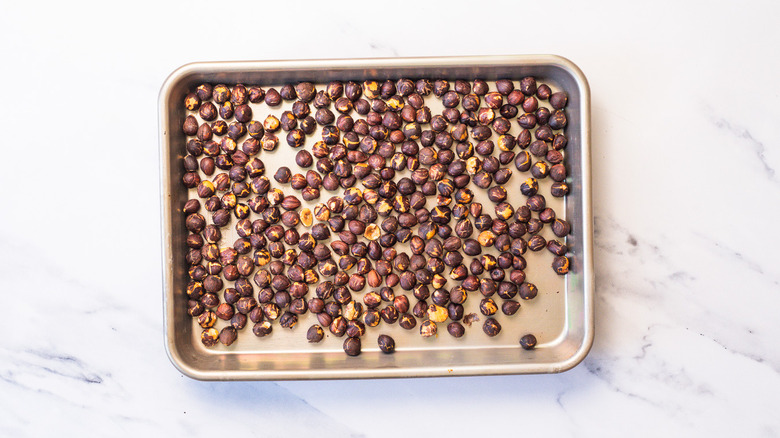 Roasted hazelnuts on sheet