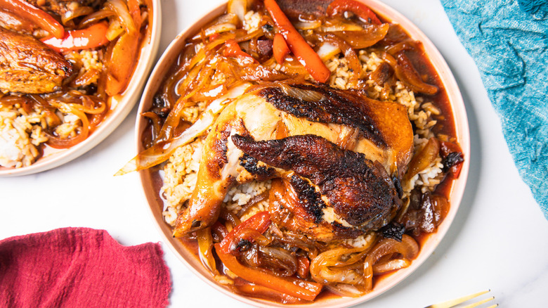 Homestyle Filipino chicken adobo stir-fry on white plate over rice
