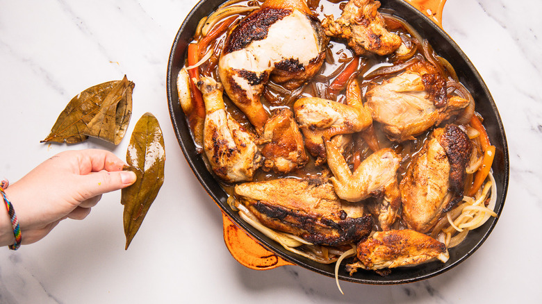 Removing bay leaves from pan