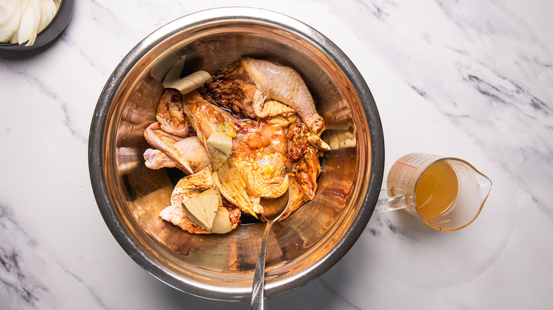 Marinating chicken in bowl