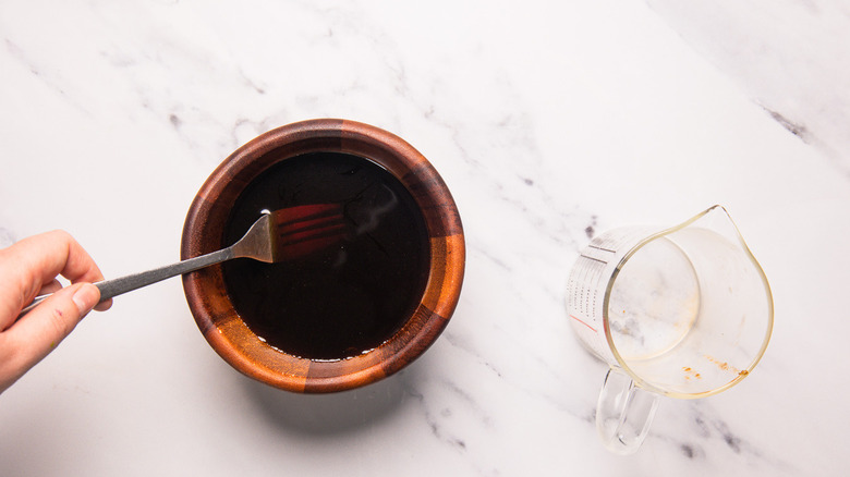 Whisking adobo sauce