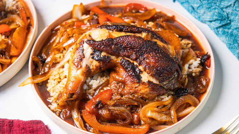 Homestyle Filipino chicken adobo stir-fry on white plate over rice