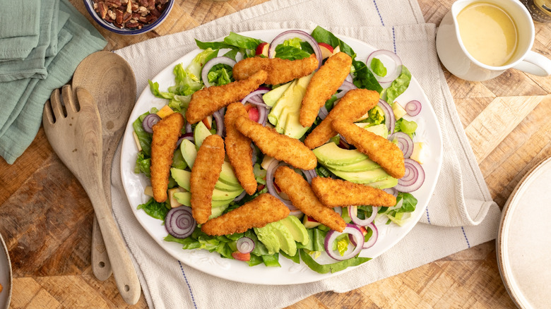 chicken tenders on salad platter