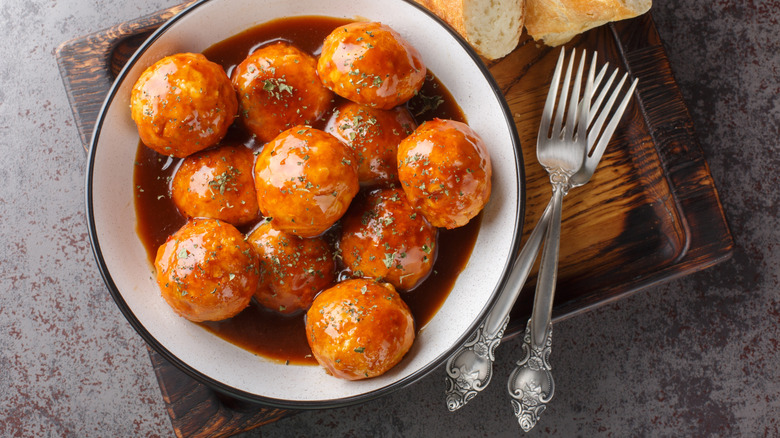 bowl of honey glaze meatballs with side of bread