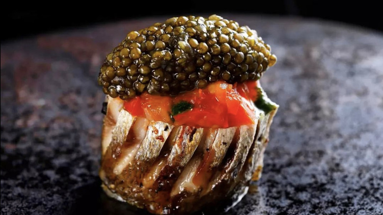 Charcoal grilled Kamasu stuffed with eggplant topped with Oscietra caviar, Ta Vie