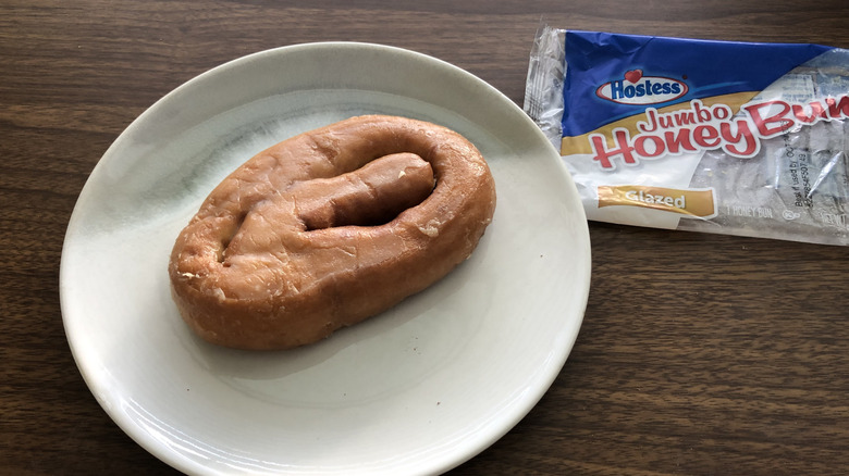 Hostess Jumbo HoneyBun on a plate.
