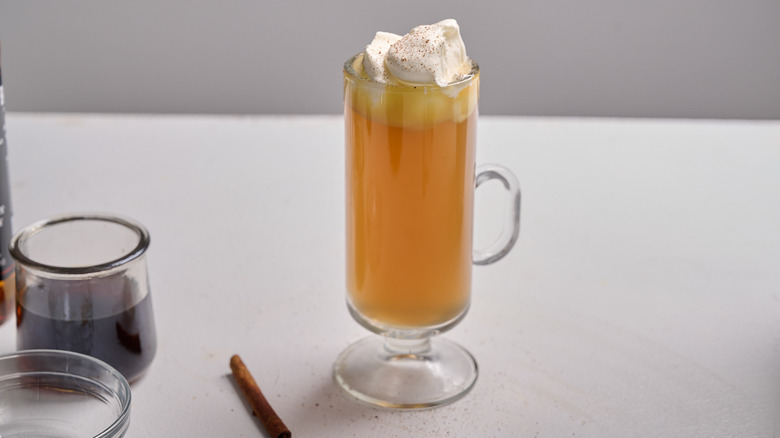 cocktail topped with whipped cream and cinnamon