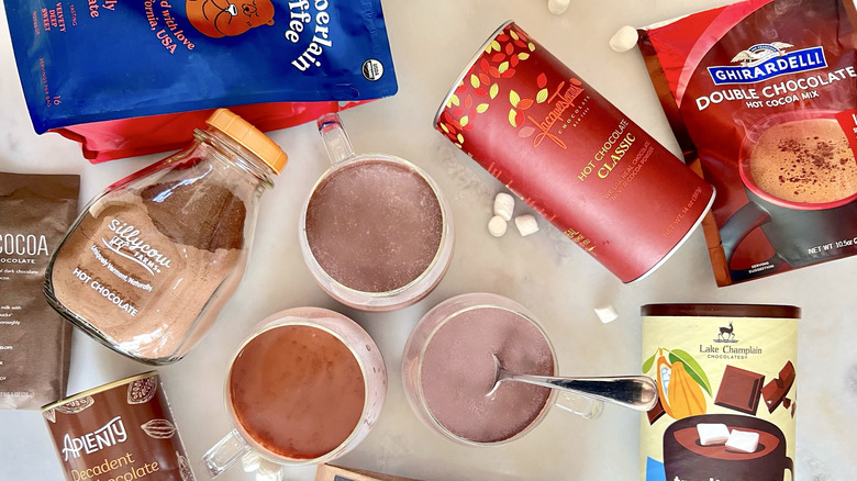 Cups of hot chocolate and packages
