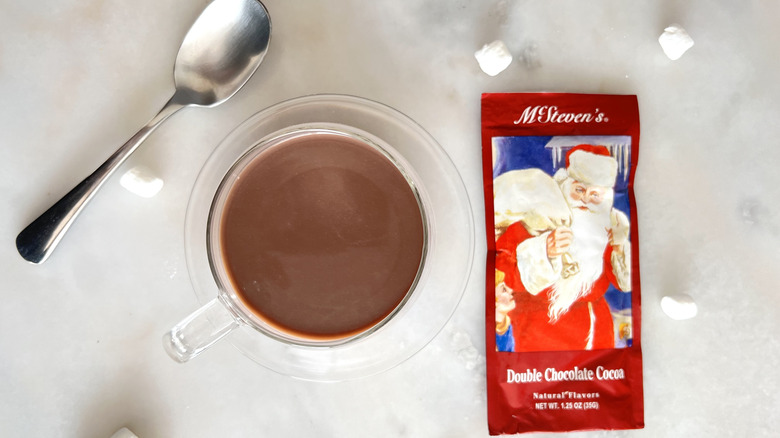 Mug of cocoa and package