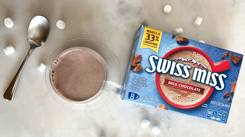 Mug of cocoa and package