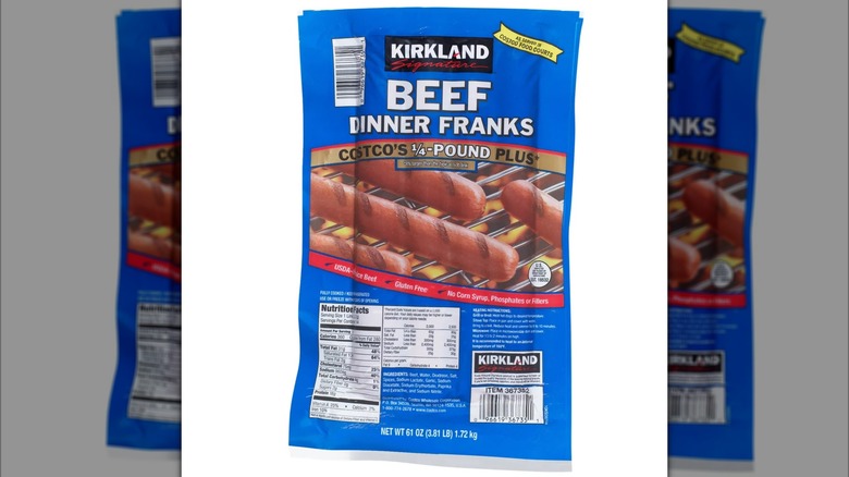 Blue package of Costco Kirkland Signature Beef Dinner Franks on white background
