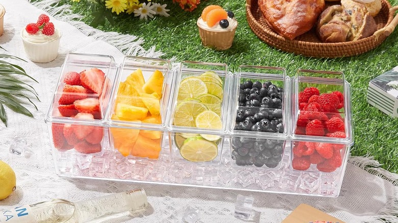 Condiment caddy filled with fruit outside