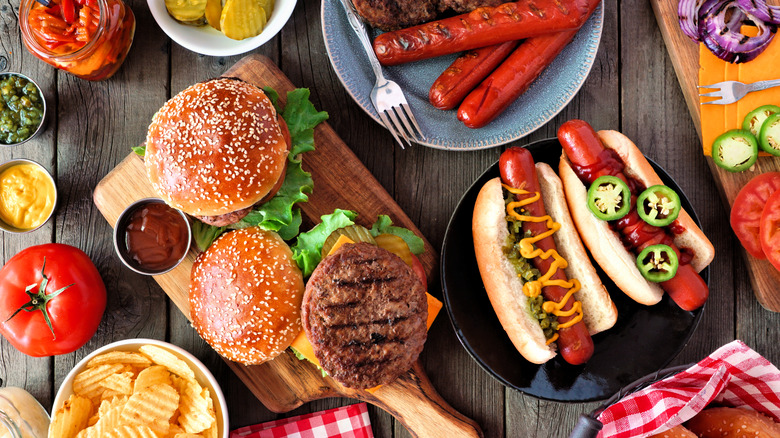 Spread of hot dogs, hamburgers, condiments