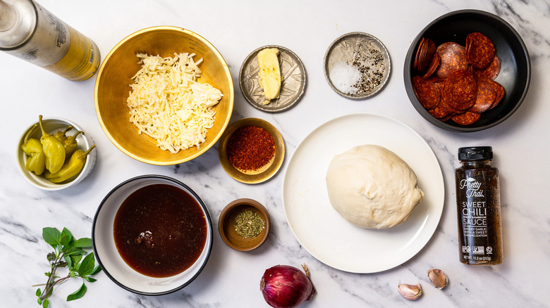 Ingredients for hot honey pepperoni pizza.