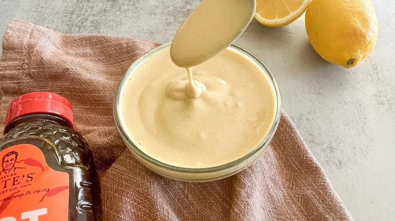 Hot Honey Mustard in small bowl with spoon above