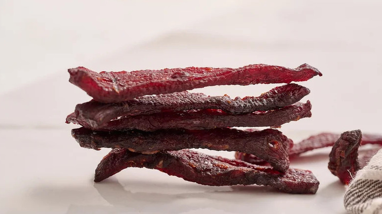 Sweet and Spicy Homemade Beef Jerky on white countertop