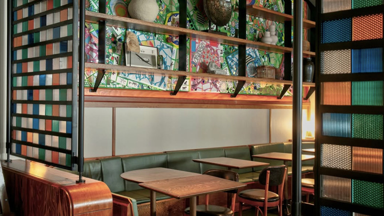 a room with wooden tables and colorful accents