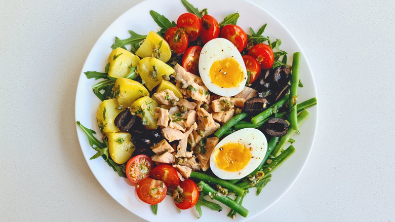Top view of tuna niçoise salad on plate
