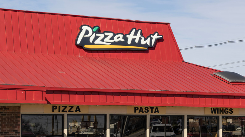close up of Pizza Hut restaurant with red roof