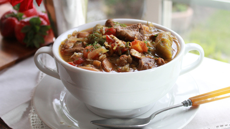 Burgoo in white handled bowl with spoon