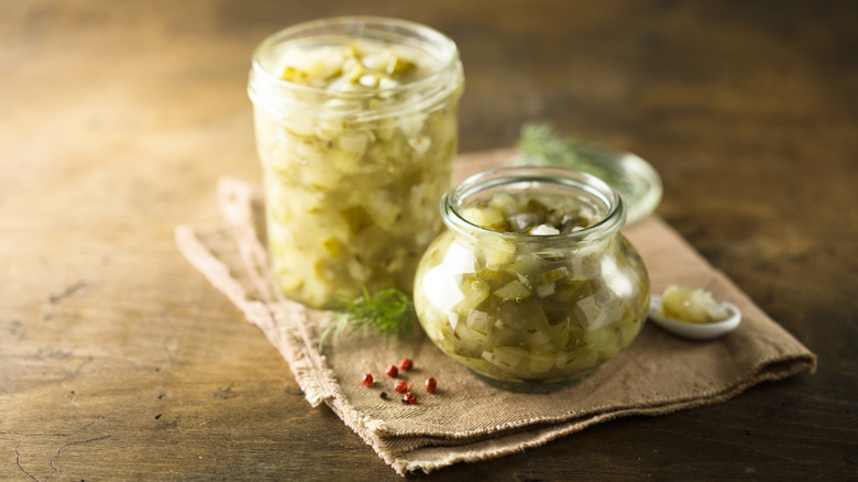 Two different open jars of relish