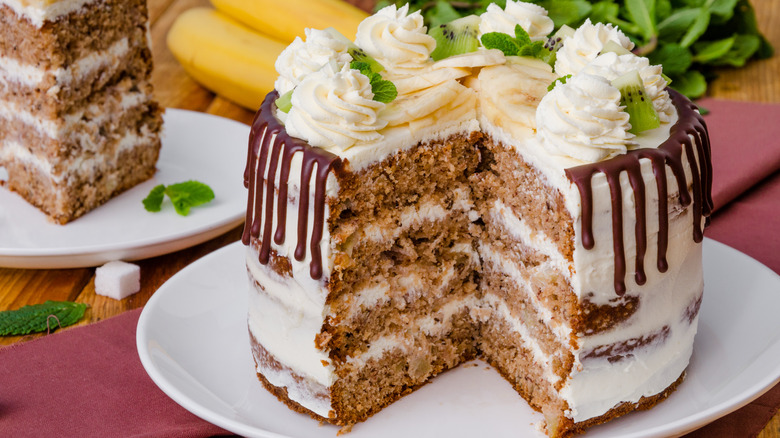 Hummingbird cake with slice missing and on plate in background
