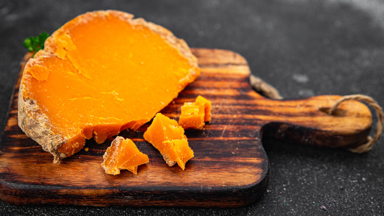 Orange Mimolette on a cutting board