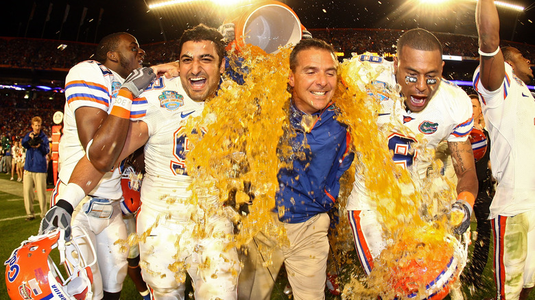 Florida Gators head coach Urban Meyer getting dumped with Gatorade by players after game