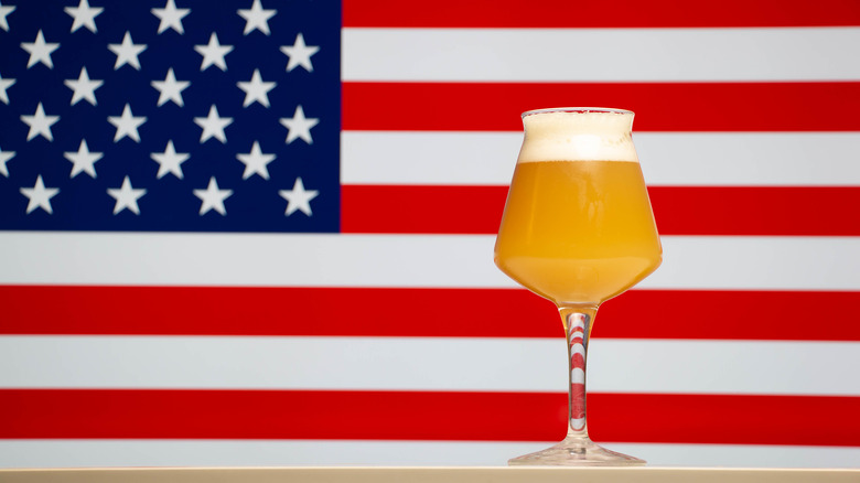 Beer glass in front of an American flag