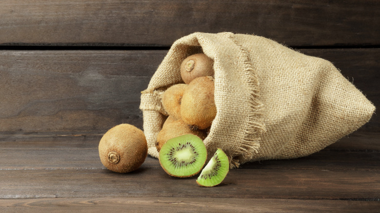 kiwi fruit in burlap bag
