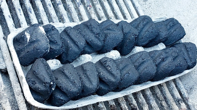 charcoal briquettes in an egg carton