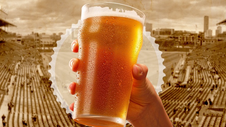 holding beer glass over baseball game background