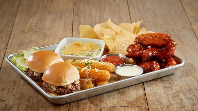 BJ's Brewhouse Bites Sampler with hamburger slides, dip, chips, mozzarella sticks, and sauce