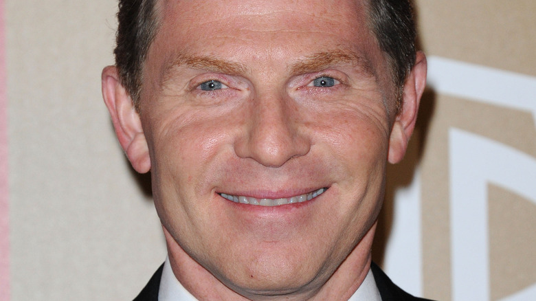 Bobby Flay smiling at event 